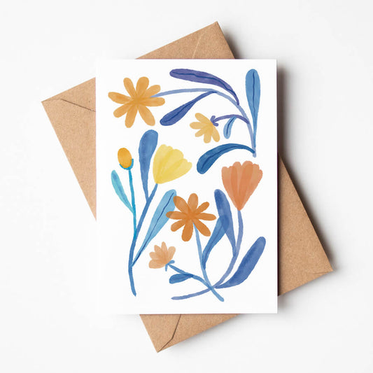 A eco friendly greeting card featuring a botanical design of orange and blue flowers. Made by Bert and Roxy