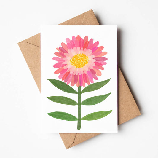 An eco-friendly illustrated greeting card featuring a pink gerbera daisy. Made with eco-friendly materials