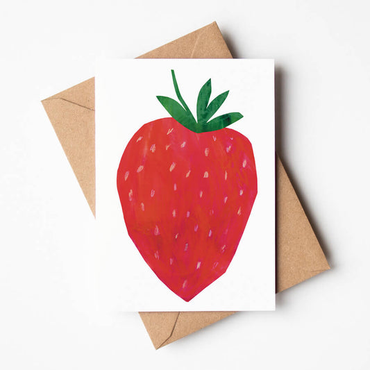 A illustrated greeting card of a big strawberry on a white background. The eco-friendly card is paired with a brown paper envelope. 