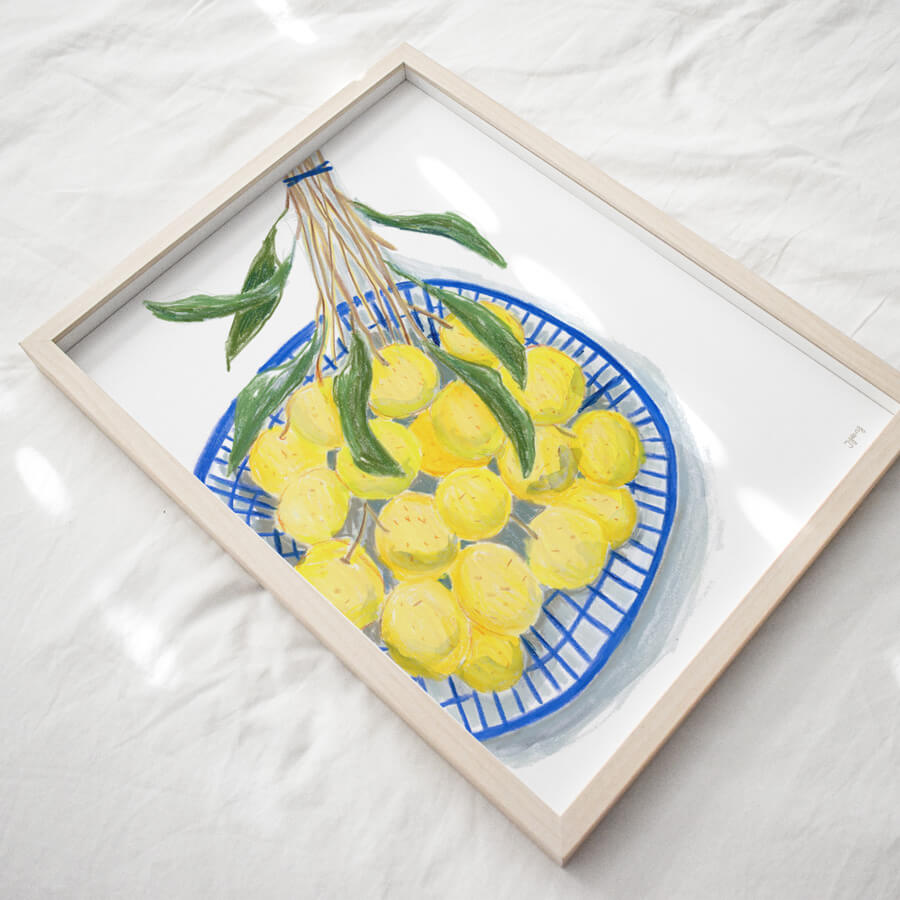 a eco friendly framed art print of illustrated longan fruit in a blue basket