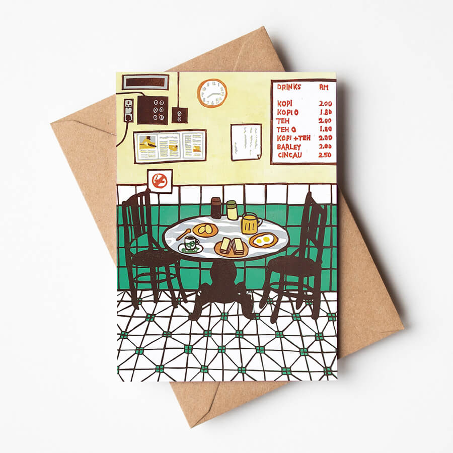 A digital reproduction from a reduction linocut of a traditional Malaysian Kopitiam. Printed as a eco friendly greeting card with a recycled envelope