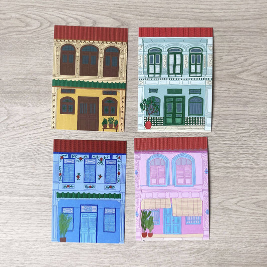 A set of four illustrated postcards printed on recycled card with 4 different coloured heritage shophouse fronts
