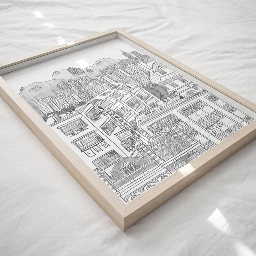 A angled view of a framed eco friendly giclee print showing the cityscape in Hong Kong